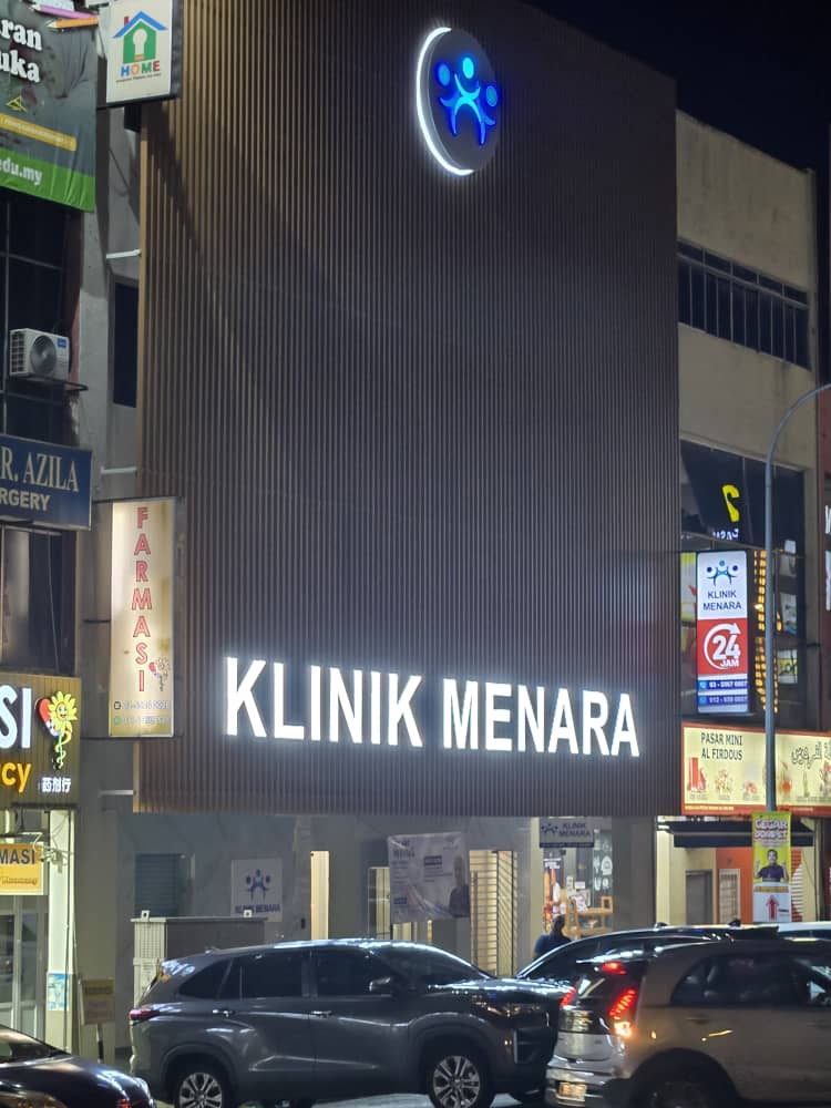 Klinik Menara building exterior at night